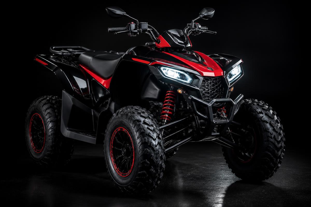 Clean red and black ATV quad under dramatic lighting